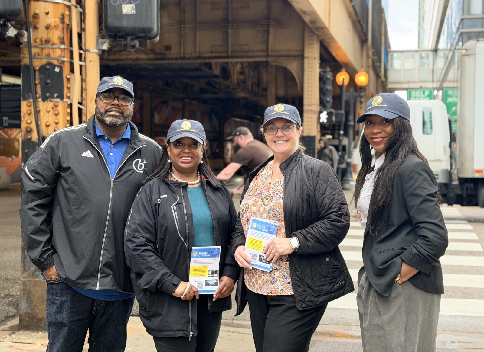 Members of the Community Engagement team pose for a photo while doing outreach about the CCSAO's efforts to prosecute crime effectively and efficiently.